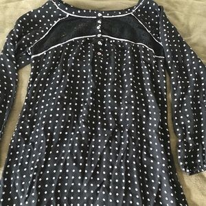 black and pruple pocka-dot shirt